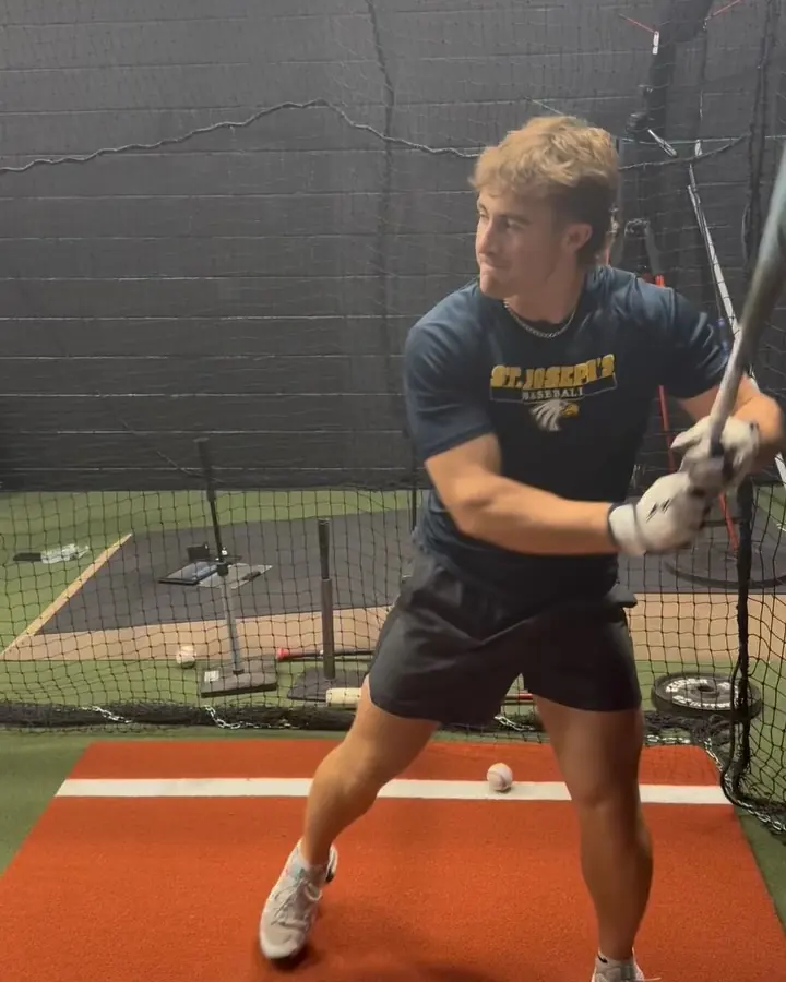 Athlete training in the indoor cage at Complete Baseball Performance