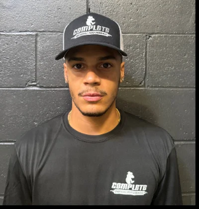 KK Delacruz in a Complete Baseball Performance cap and shirt